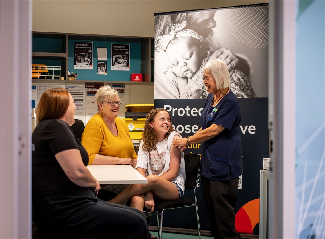 Registered Nurse Mei, pictured with Isla and her mum Georgia and grandmother Judy.