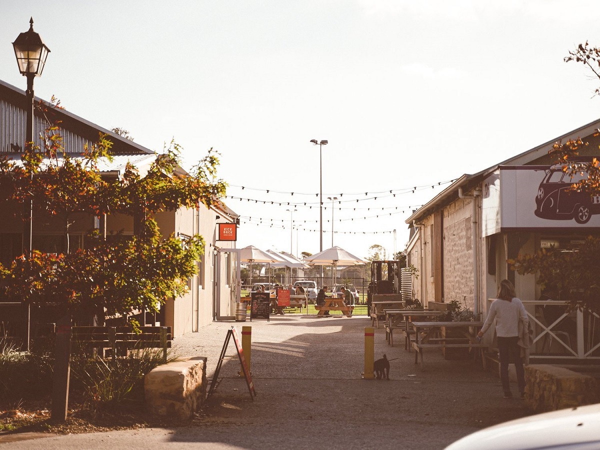 The sunny laneway between the Home Grain bakery and Kick Back brewing.