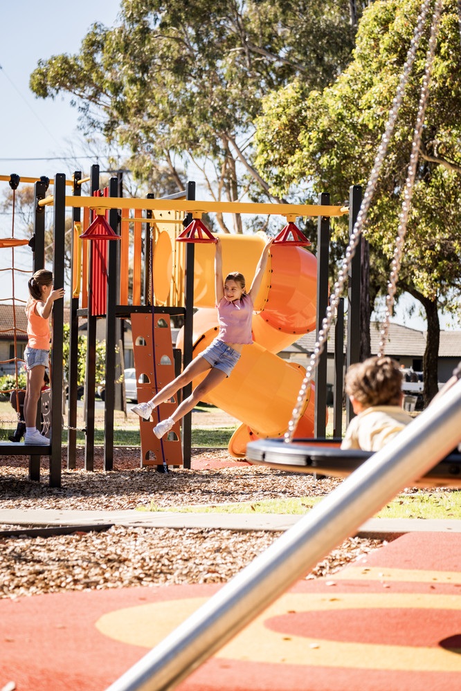 Ariana and Alirah on monkey bars